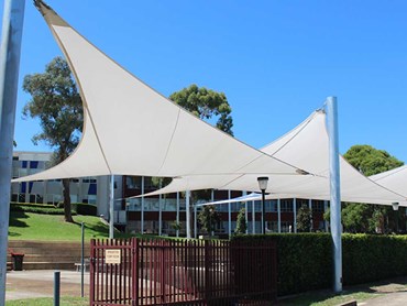 Commercial Heavy 430 FR shade sails transformed the space into a multipurpose facility