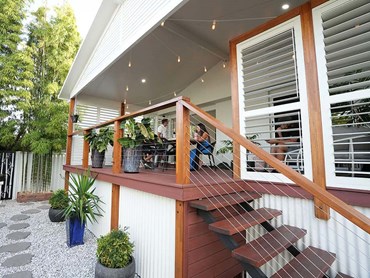 The gable-style patio complements the roofline and design of the home