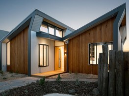 Raked roof, clestory windows shape light at Northcote Solar Home by Green Sheep Collective