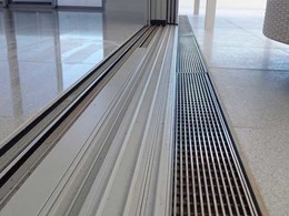Stainless steel level threshold drains providing seamless transition from indoors to outdoors