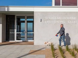 Custom concrete paving enables clubhouse to blend with foreshore setting