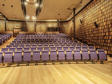 Customised curved timber-slatted acoustic panels were supplied for the auditorium and entrance area