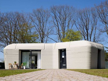 The 3D-printed concrete house in Eindhoven is boulder-shaped with load-bearing walls