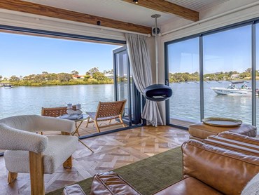 Versailles timber flooring adds elegance and rustic charm, redefining the houseboat experience