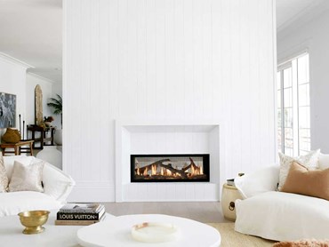 Lopi double-sided gas fireplace adds heat and ambience to both living spaces