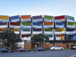 Multi-coloured stacked apartments embody multicultural Melbourne suburb