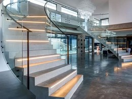 Twin bent glass curved staircases created to perfection at Lake Macquarie house