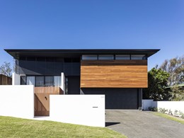 Vertical wood-look battens provide privacy and define the entrance at Peregian beach home