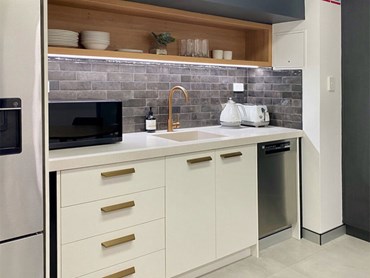 The innovative kitchenette design, fitted with a Corian® Solid Surface benchtop in Linen