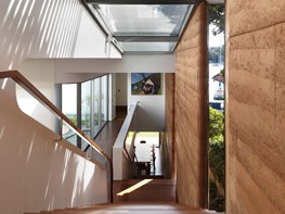 A self-cooling stairwell & rammed earth walls in Luigi Rosselli’s textural Kirribilli residence