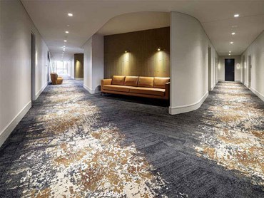 The custom carpet in cream, gold and charcoal created with Designer Jet technology