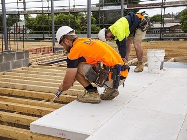 MaxiFloor being installed in a new apartment block in Preston, SA (Photographer: Mannix Photography)
