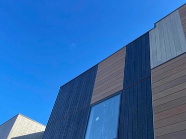Cemintel Territory lightweight cladding in vertical and horizontal styles on the townhouse facade