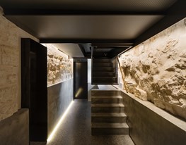 Architect turns run-down pre-war bomb shelter into a sophisticated "wine cave"