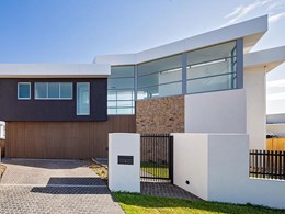 Timber look façade conceals entrance and garage at Cronulla home