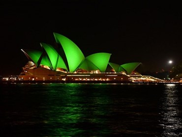 Sydney Opera House sails lit green
