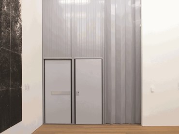 Wide span fire shutters with integrated doors for egress