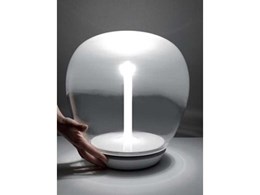 New table lamps from Artemide combine traditional blown glass with LED tech