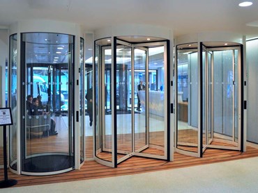 Revolving doors exclude threats while allowing smoothly regulated traffic flow