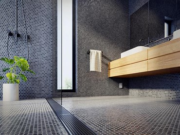Stormtech Marc Newson designed black linear drains in modern bathroom
