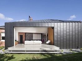 Zinc-clad addition to heritage dwelling with secret guttering