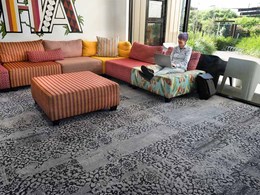 Bespoke carpet flooring captivates at Roomie Apartment Hotel
