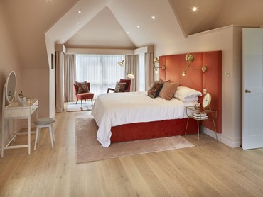 Mill House bedroom featuring Champagne flooring