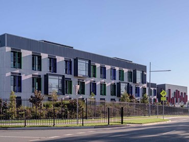 Cemintel's Barestone prefinished cladding provided a natural finish in a range of grey hues 