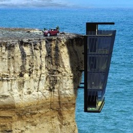 Five-storey modular house clings to a cliff face like a barnacle