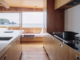 Integrated appliances enable seamless flow of wood interiors in ‘social kitchen’