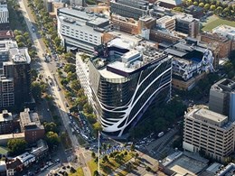 Melbourne cancer care facility sky signs stand out against striking Lysaght cladding