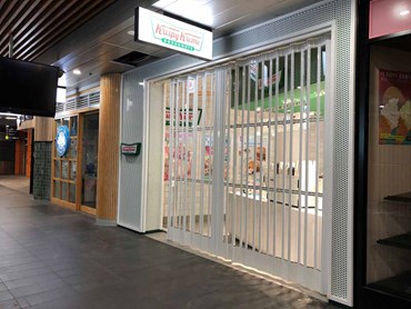 Krispy Kreme shop front with security shutters 