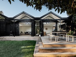 Beach vibes in a “pleated” timber house