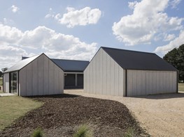 Two CFC-clad gable pavilions provide art studio and garage for Victorian farm