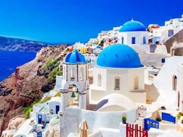 White buildings in the village of Oia on the Greek island of Santorini. Image: Shutterstock
