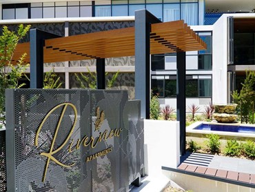 Bespoke welcome signage at Riverview featuring perforated metal