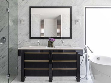 Diadema wall lights add to the timeless appeal of Cararra marble in the bathroom