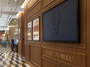 Elton Group worked with Sofitel’s developer Palumbo to create a custom stained oak, WoodWall