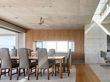The juxtaposition of concrete and timber is a continuing theme and feature of the interior spaces