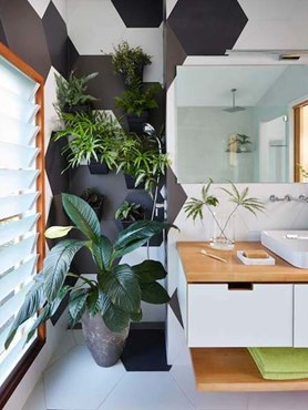 Compact bathroom with oversized tiles and space-saving Kohler bathroom fixtures
