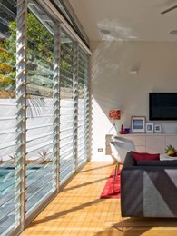Multiple bays of Altair louvre windows connect indoors and outdoors at Coogee House 