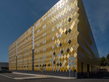 Evolution Axis panels with aluminium shingle rainscreen facade in three shades of gold