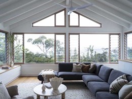 Natural-looking Wood finish aluminium windows frame ocean views at coastal home