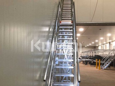 The KOMBI stair and platform system would allow access to a loft area above the machinery