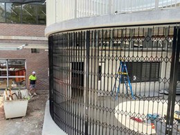 Curved retractable security screens for public buildings