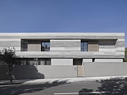 Travertine stone creates banding effect on South Yarra house façade