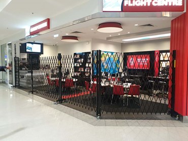 Flight centre shopfront movable security barrier 