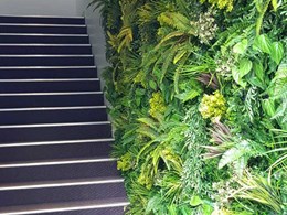 Custom green wall on stairway at Encompass Business Park