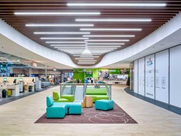 Ceilings with integrated lighting add to modern retail experience at COOP mall in Swiss town